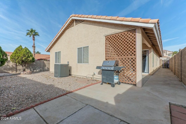 back of house featuring a patio and central AC unit