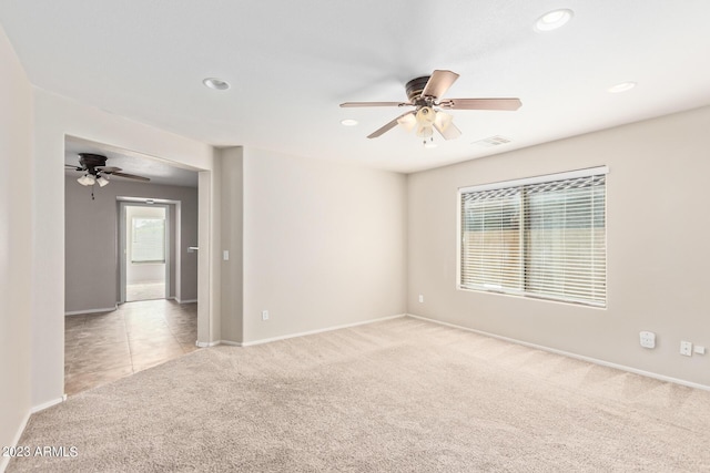 carpeted spare room with baseboards, a ceiling fan, visible vents, and recessed lighting