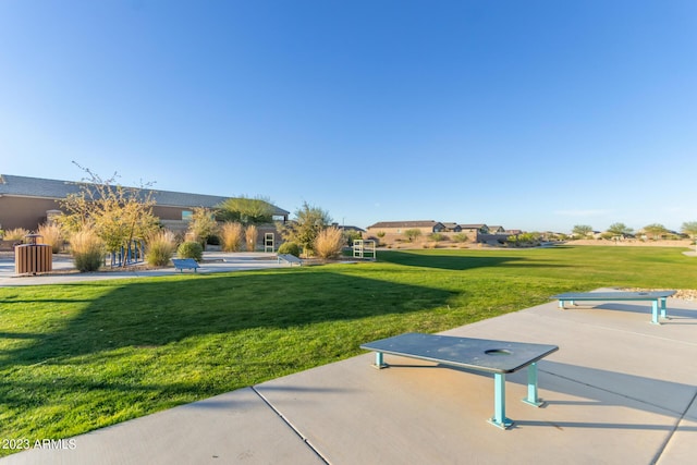 view of home's community with a yard