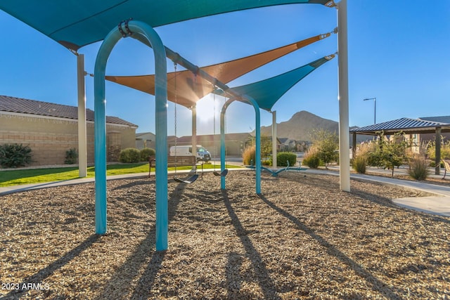 community playground with a mountain view