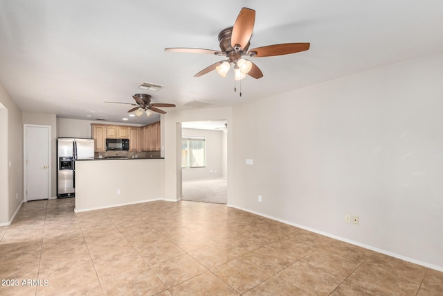 unfurnished living room featuring visible vents, ceiling fan, baseboards, and light tile patterned floors