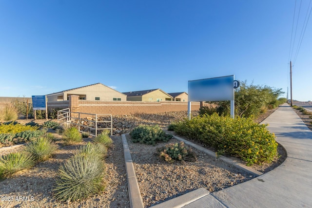 view of community featuring fence