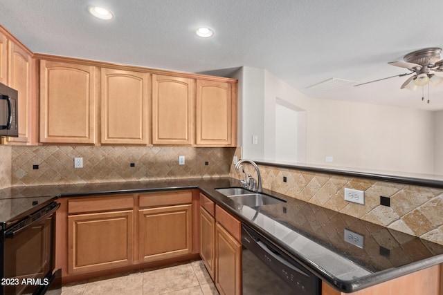 kitchen with tasteful backsplash, a sink, dark stone countertops, a ceiling fan, and black appliances