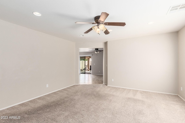 spare room featuring a ceiling fan, visible vents, recessed lighting, carpet flooring, and baseboards