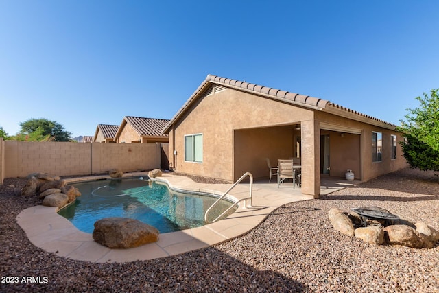 view of swimming pool featuring a patio, a fenced backyard, and a fenced in pool