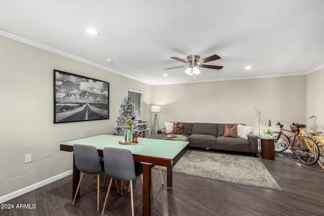 dining space with ceiling fan, dark hardwood / wood-style flooring, and crown molding