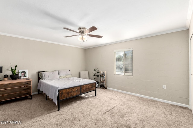 bedroom featuring ceiling fan, crown molding, and carpet