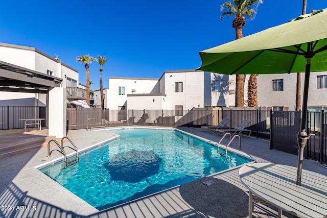 view of pool featuring a patio