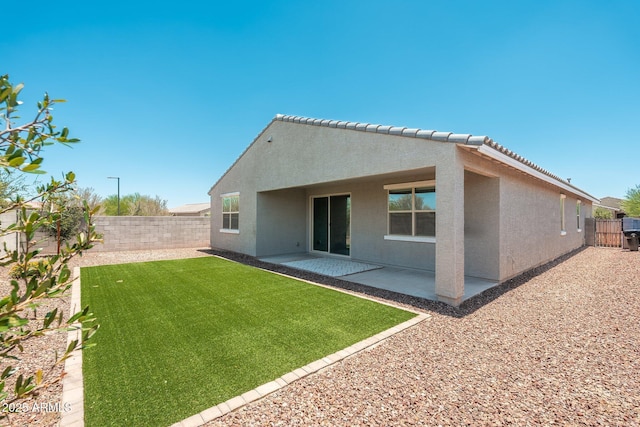 17652 W Fetlock Trl, Surprise, AZ 85387 - rear view of house featuring stucco siding, a fenced backyard, and a patio