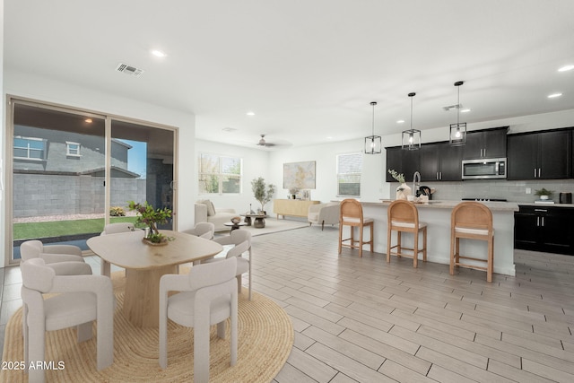 17652 W Fetlock Trl, Surprise, AZ 85387 - dining room with recessed lighting and ceiling fan