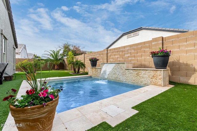 view of swimming pool featuring a lawn and pool water feature