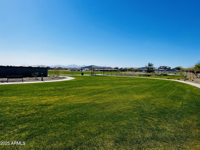 view of yard featuring a gazebo and a mountain view