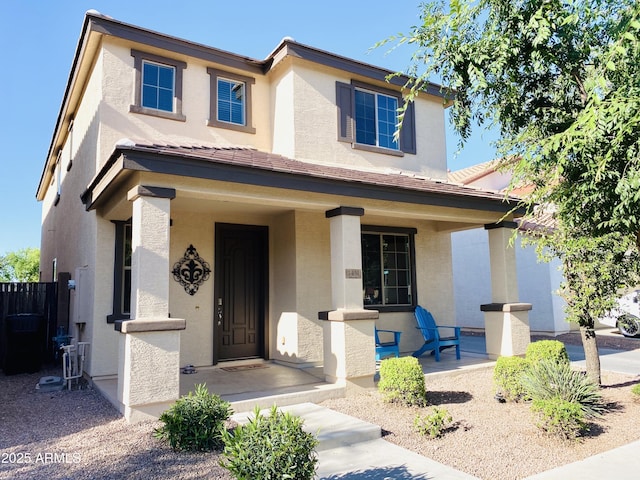 view of front of property with covered porch and stucco siding