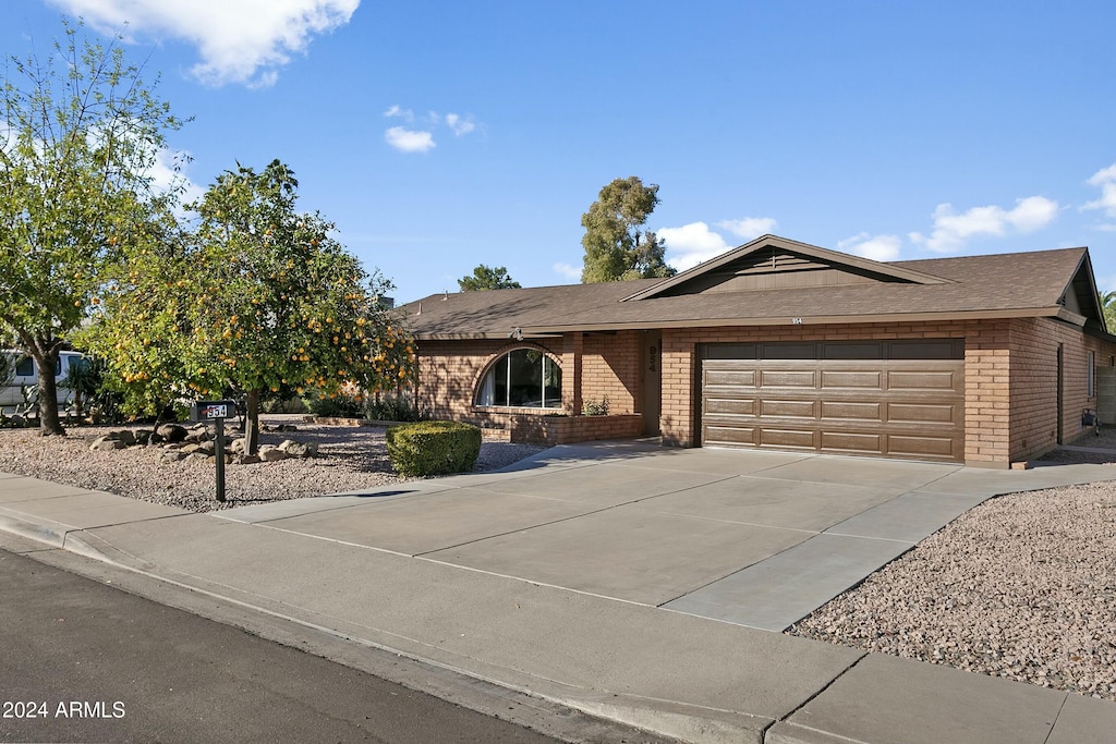 ranch-style house featuring a garage