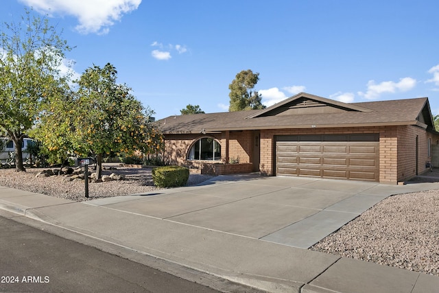 ranch-style house featuring a garage