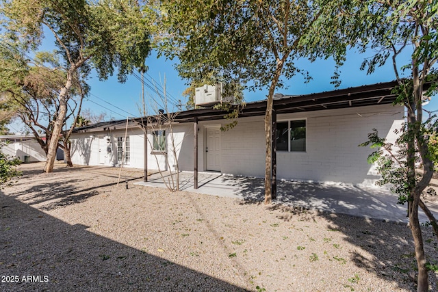 rear view of house with a patio