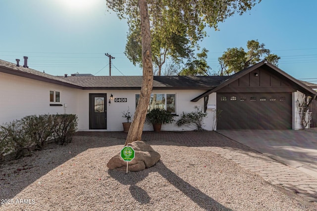 ranch-style house featuring a garage