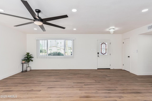 foyer with wood-type flooring and ceiling fan