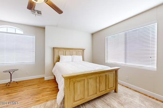 bedroom featuring light hardwood / wood-style floors and ceiling fan