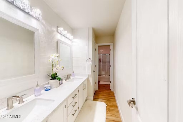 bathroom with vanity and hardwood / wood-style flooring