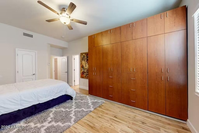 bedroom featuring light hardwood / wood-style floors and ceiling fan