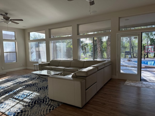 sunroom featuring plenty of natural light and ceiling fan