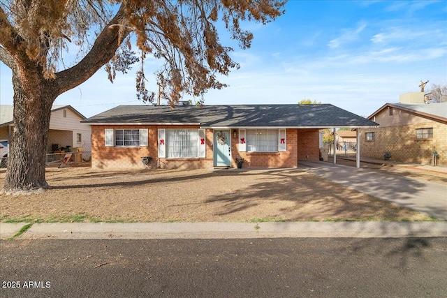 ranch-style home featuring a carport