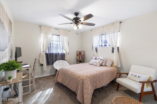 carpeted bedroom with multiple windows and ceiling fan