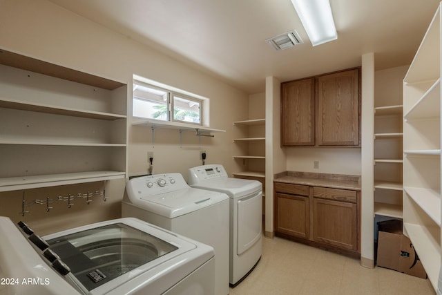 clothes washing area featuring washing machine and dryer