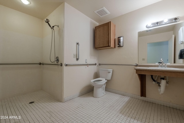 bathroom featuring a shower, sink, tile patterned flooring, and toilet