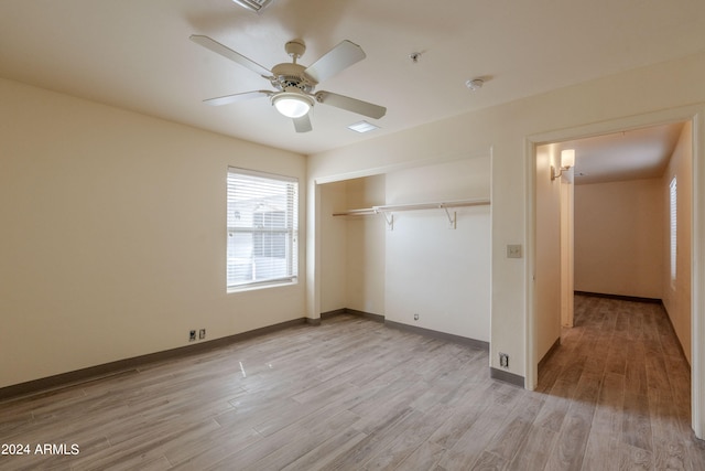 unfurnished bedroom with a closet, ceiling fan, and light hardwood / wood-style flooring