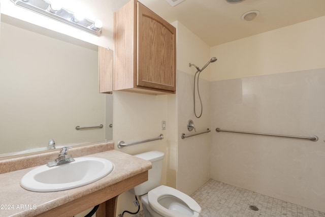 bathroom featuring a shower, toilet, and sink