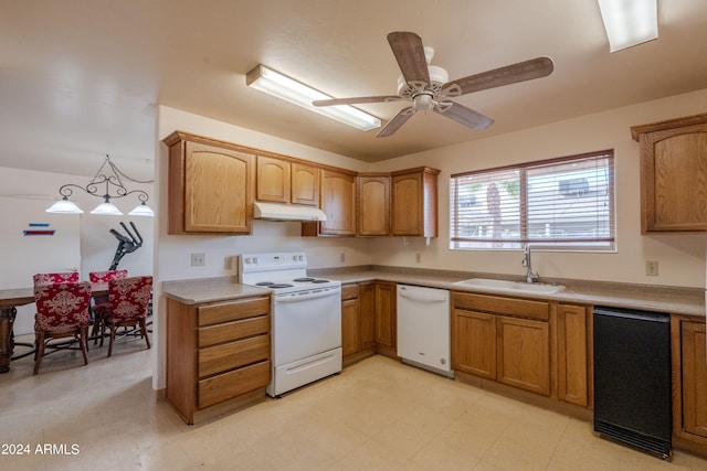 kitchen with pendant lighting, ceiling fan, white appliances, and sink