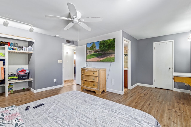 bedroom featuring wood-type flooring and ceiling fan