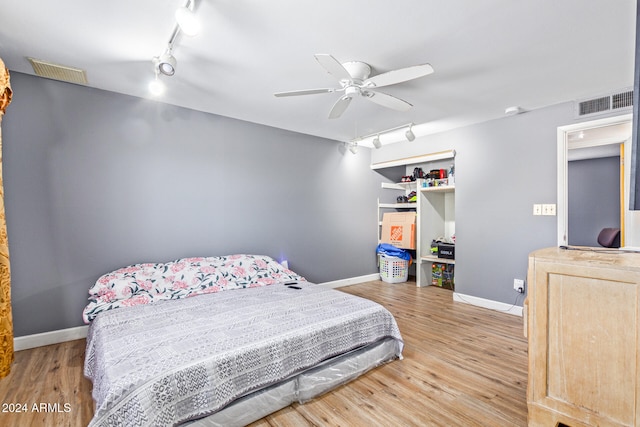 bedroom featuring light wood-type flooring and ceiling fan