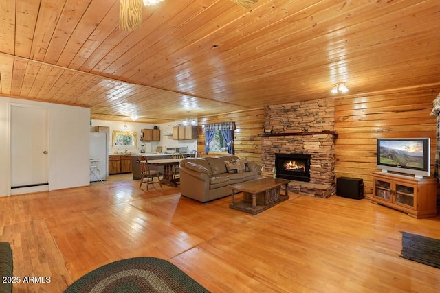 197 S Hiscox Ln, Payson, AZ 85541 - living area with wood ceiling, a fireplace, and light wood-style floors