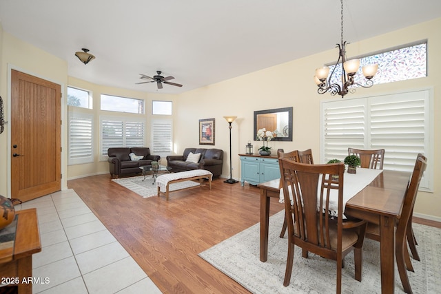 835 W Beechnut Dr, Chandler, AZ 85248 - dining space featuring ceiling fan, a chandelier, light wood-type flooring, and baseboards