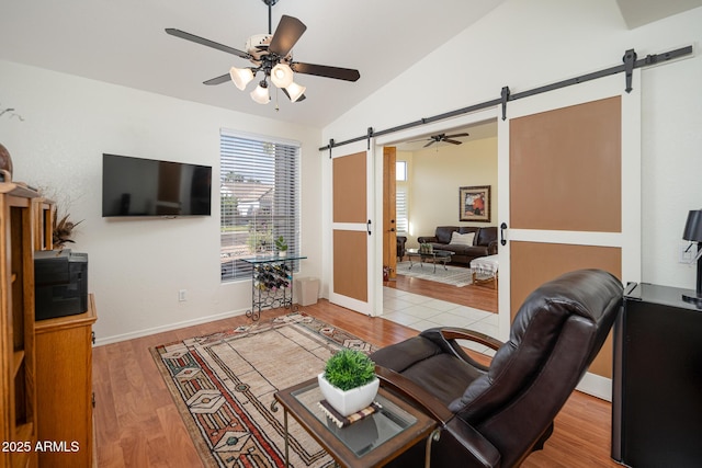 835 W Beechnut Dr, Chandler, AZ 85248 - living room featuring a barn door, ceiling fan, vaulted ceiling, and wood finished floors