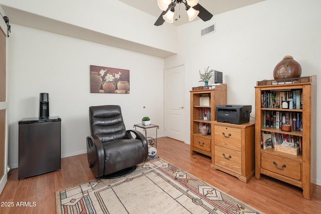 835 W Beechnut Dr, Chandler, AZ 85248 - sitting room with light wood-style flooring, ceiling fan, baseboards, and a barn door
