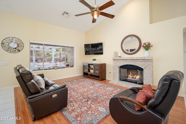 835 W Beechnut Dr, Chandler, AZ 85248 - living area featuring ceiling fan, high vaulted ceiling, a brick fireplace, wood finished floors, and baseboards