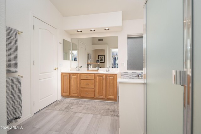 835 W Beechnut Dr, Chandler, AZ 85248 - full bath featuring double vanity, wood finished floors, an enclosed shower, and recessed lighting