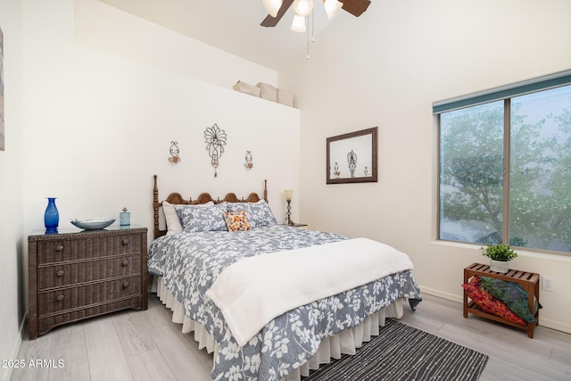 835 W Beechnut Dr, Chandler, AZ 85248 - bedroom with light wood-type flooring, a high ceiling, baseboards, and a ceiling fan