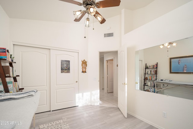 835 W Beechnut Dr, Chandler, AZ 85248 - interior space with light wood finished floors, a towering ceiling, and baseboards