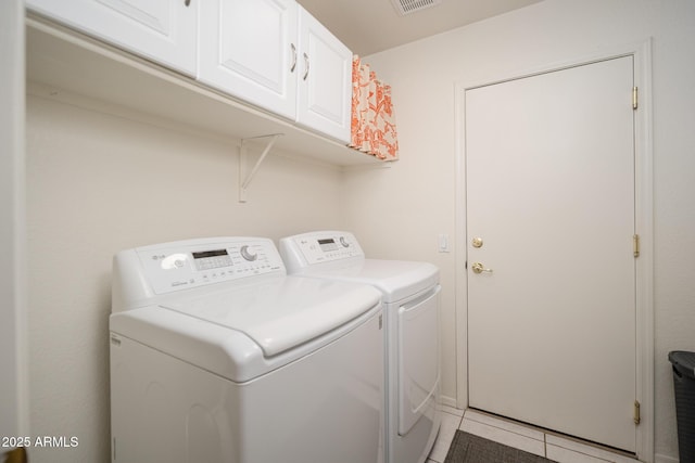 835 W Beechnut Dr, Chandler, AZ 85248 - laundry room featuring independent washer and dryer, cabinet space, and light tile patterned floors