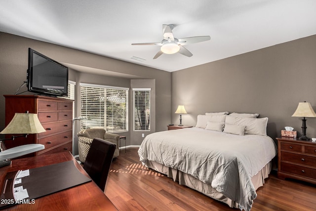 bedroom featuring dark wood-type flooring and ceiling fan