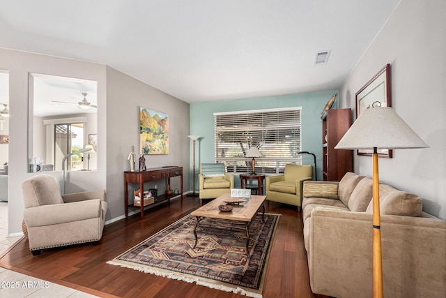 living room featuring plenty of natural light and dark hardwood / wood-style flooring