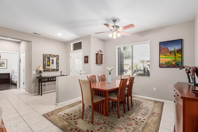 dining room featuring light tile patterned flooring and ceiling fan