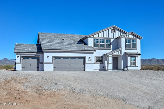 view of front of house with a mountain view and a garage