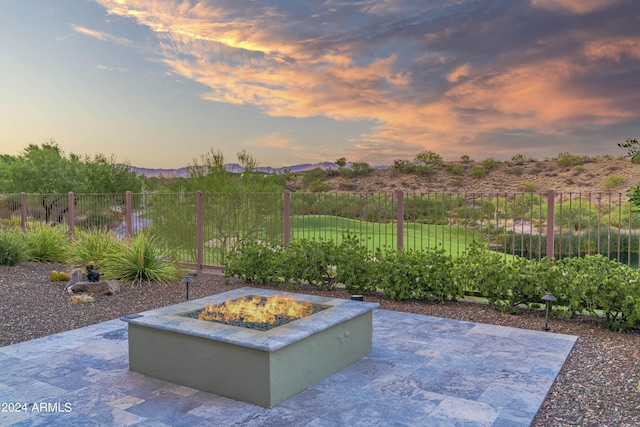 patio terrace at dusk with an outdoor fire pit