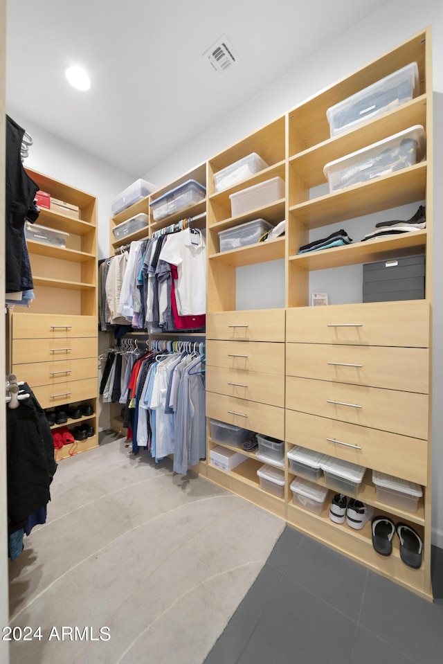 spacious closet featuring light tile patterned floors